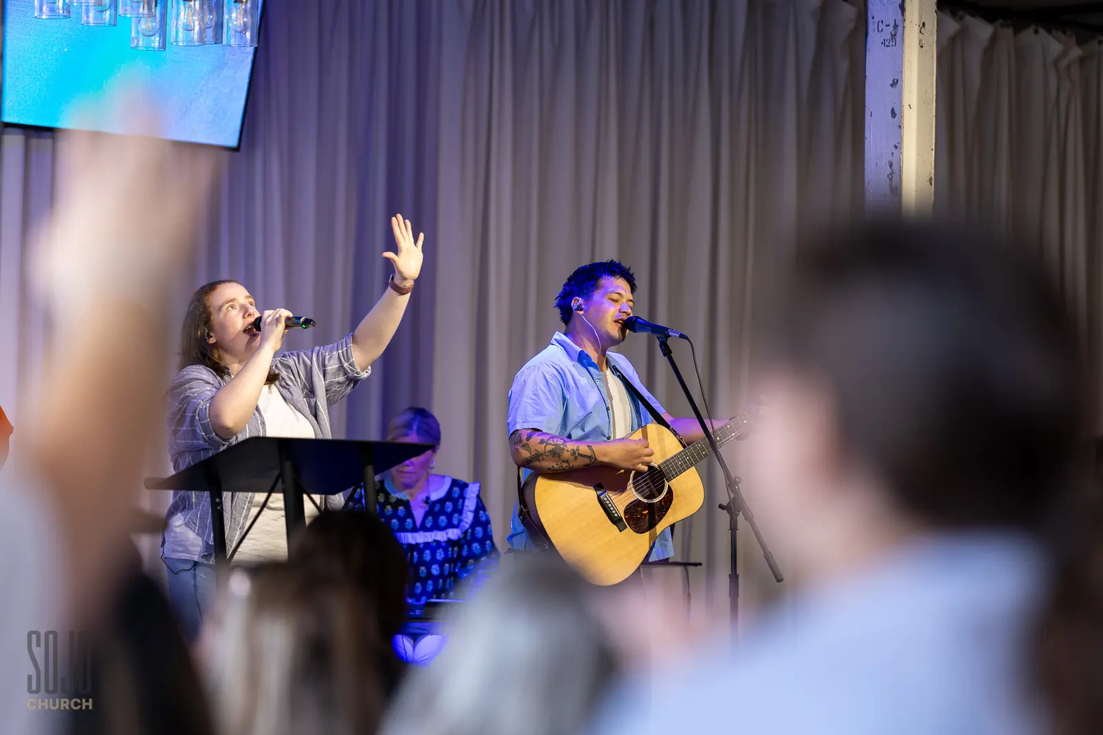 The SOJO worship team leading from the new stage at the Kettle Room