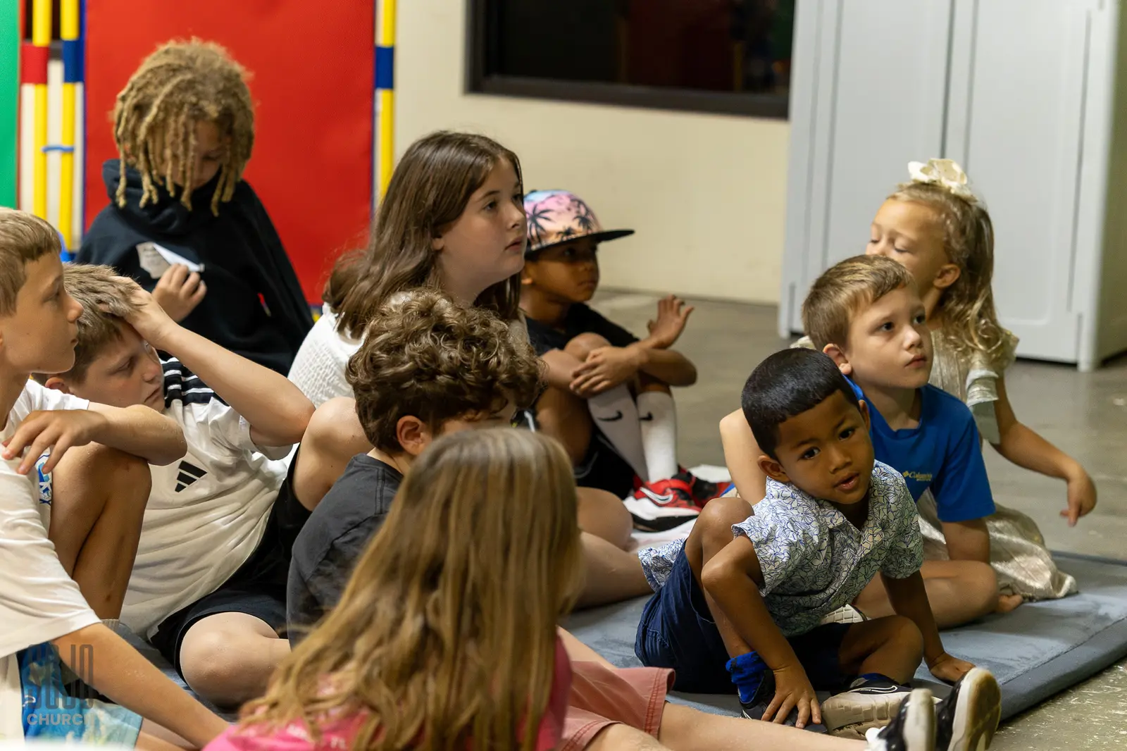 SOJO Kids sitting together for the lesson in the new kids space