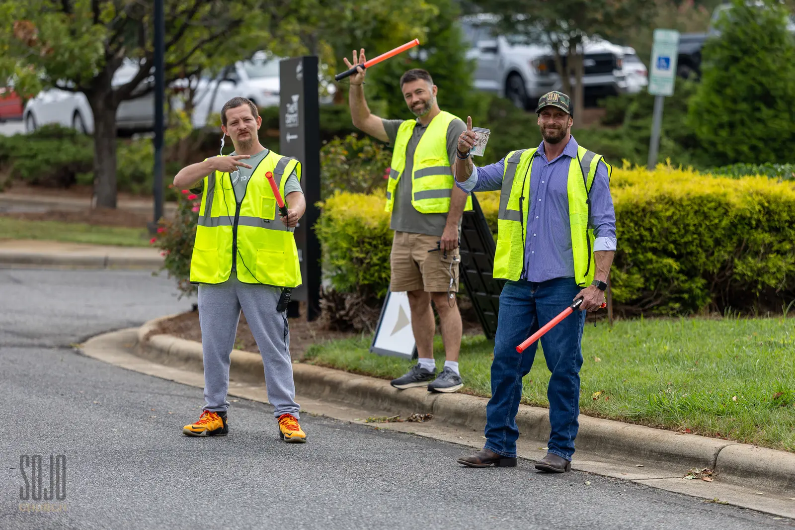 The SOJO parking team in yellow vests waving cars in on Sunday morning
