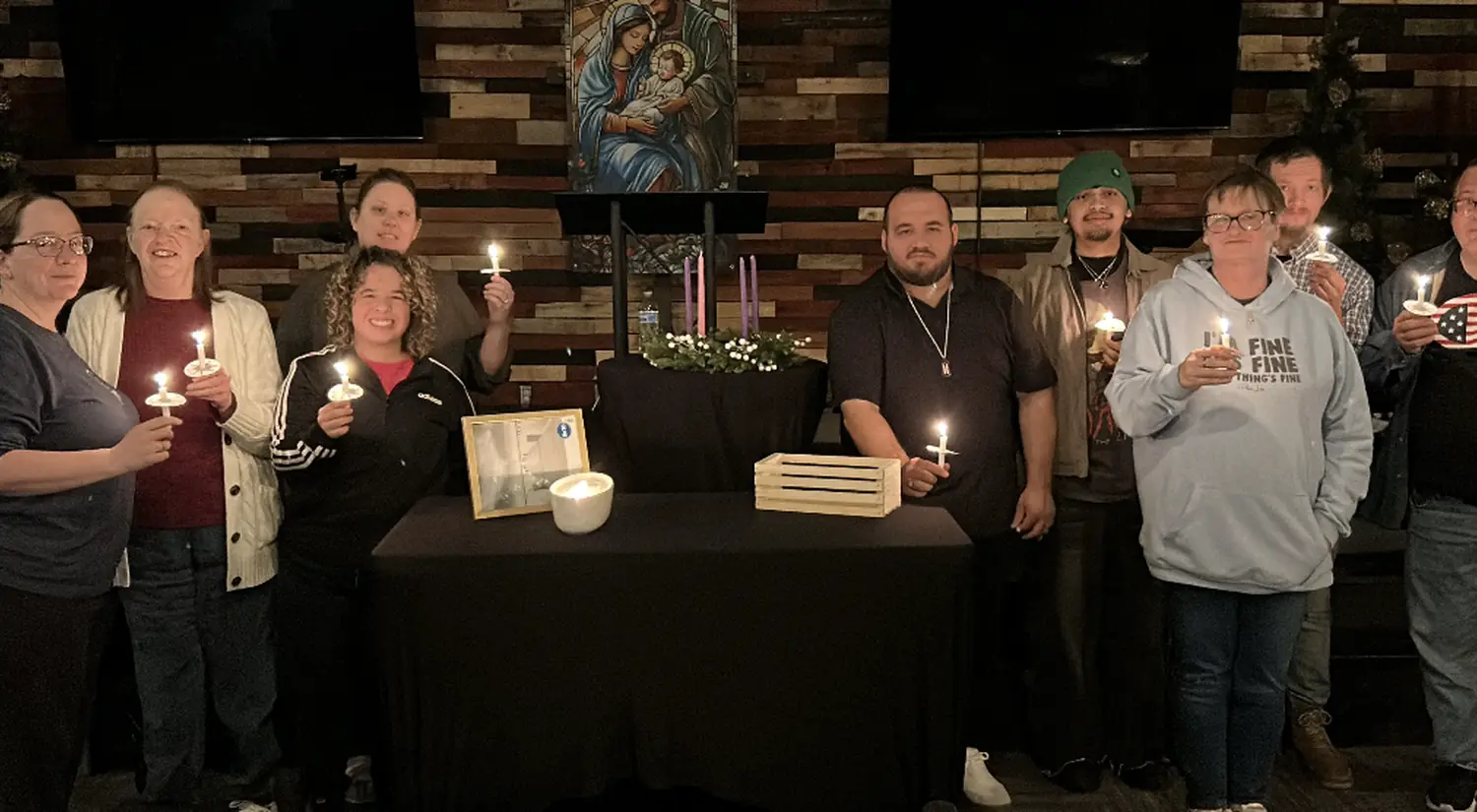 A SOJO Care Group gathered with candles
