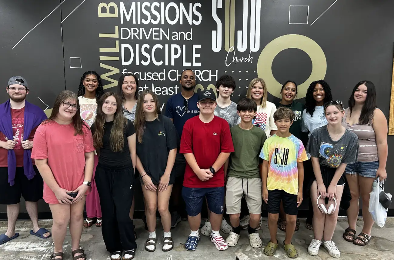 SOJO YTH students together at the SOJO missions mural