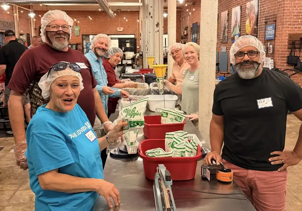SOJO volunteers packing rice and vegetable meals