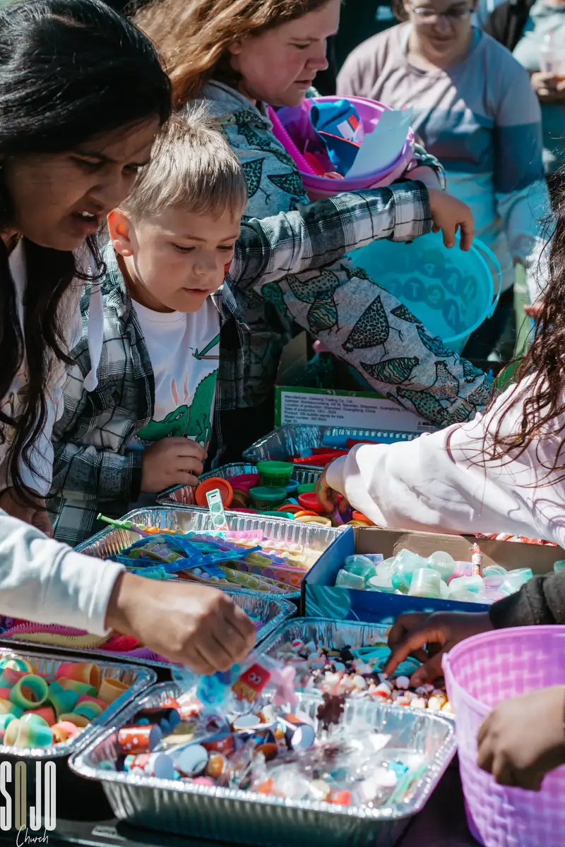 Kids picking prizes at the SOJO outreach table