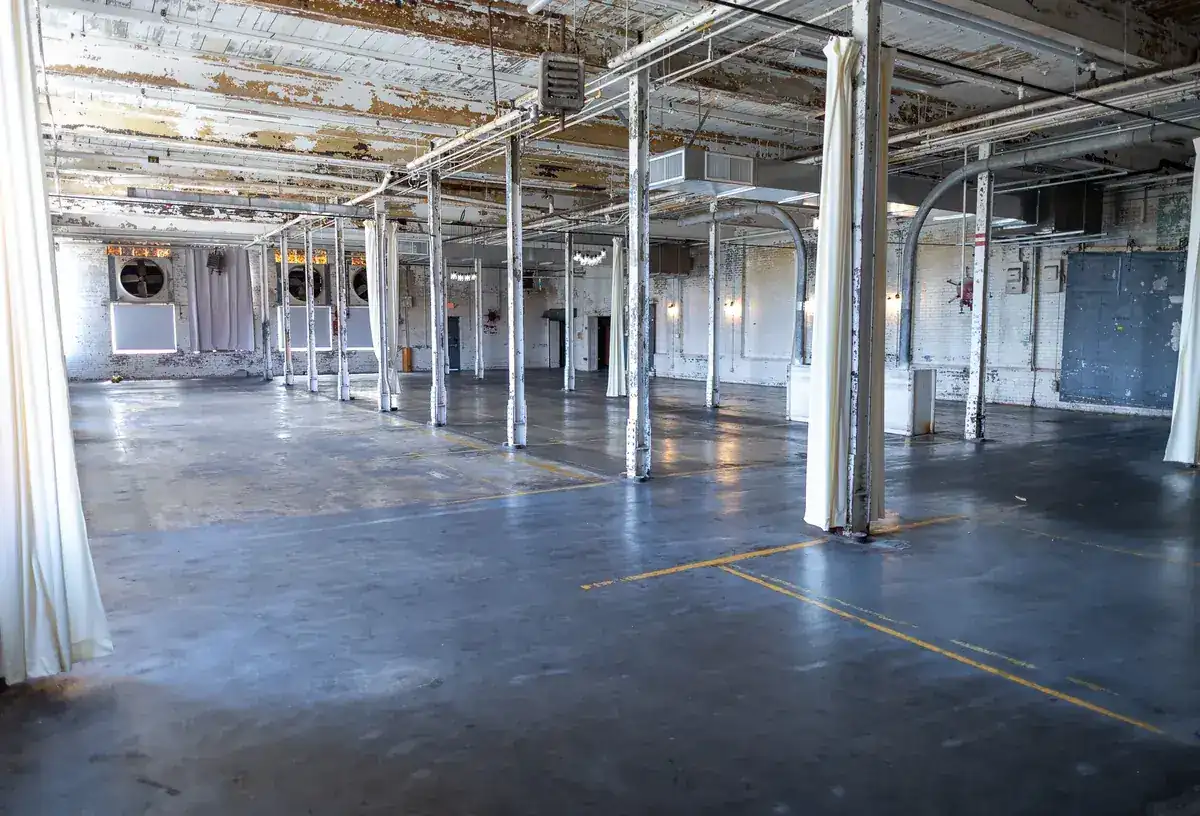 Rows of steel columns down the length of the mill floor