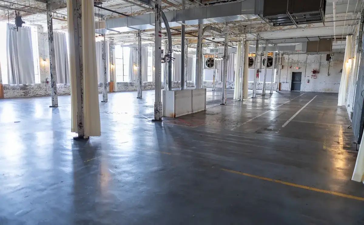 The mill floor before build-out, August 2026