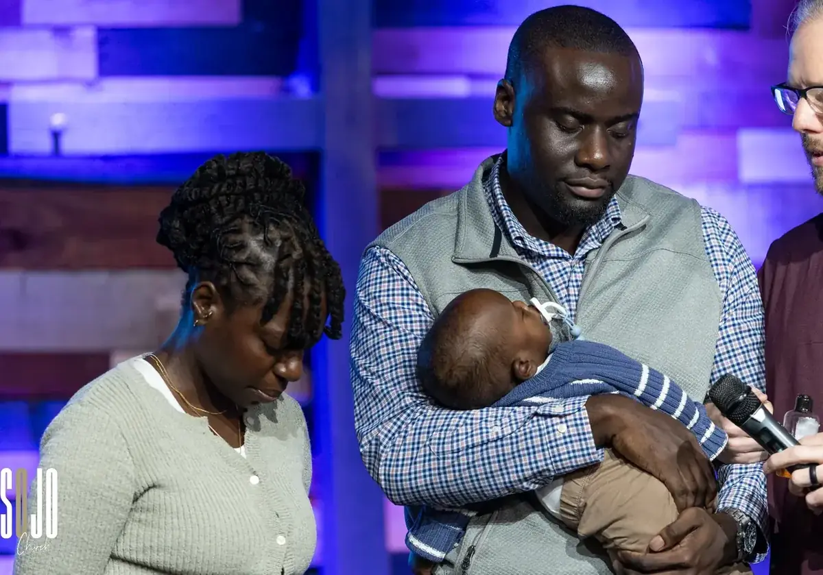 A family dedicating their newborn at SOJO