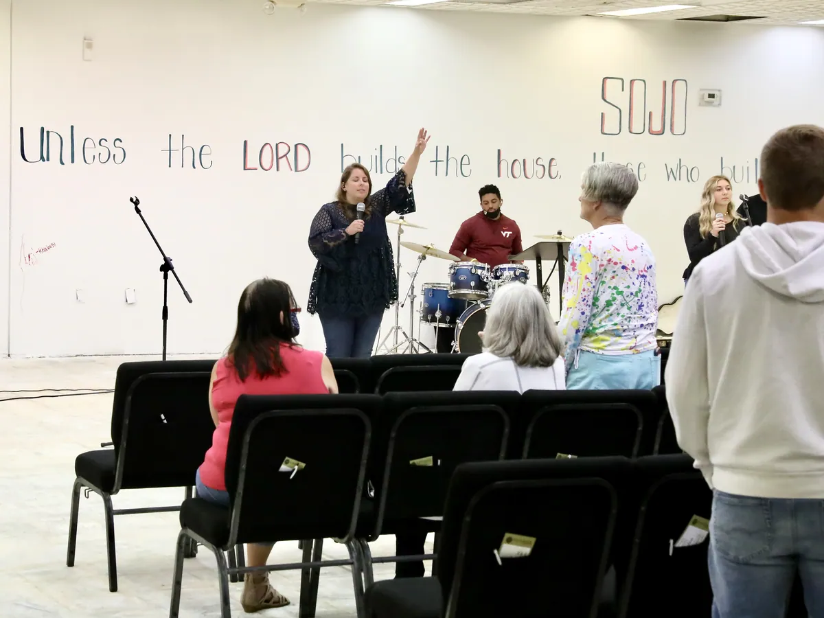Worship in front of the hand-painted wall at Union Street