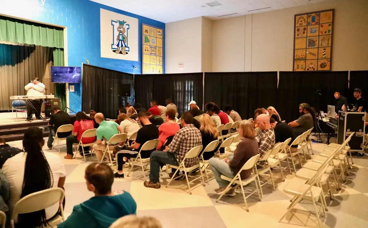 SOJO Church meeting in the cafeteria at Weddington Hills Elementary