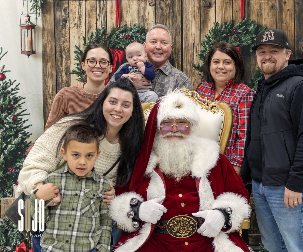 A family having their picture made with Santa at SOJO