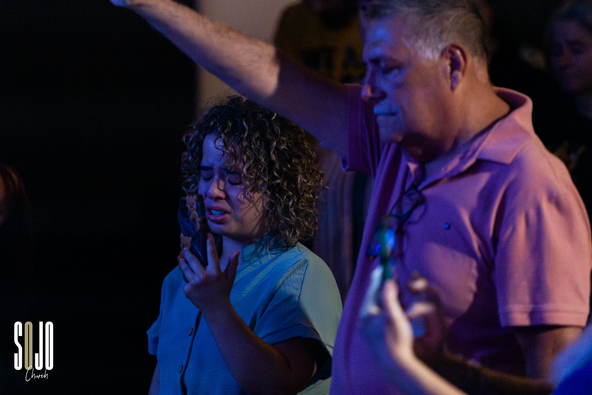 0C5A9524 People praying at a church event.