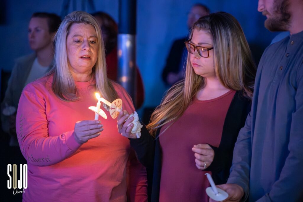 People holding candles during vigil